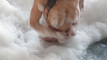video spying on a brunette bathing a guy in feminine clothing comes in and fucks her in the pearshaped ass and buries porn